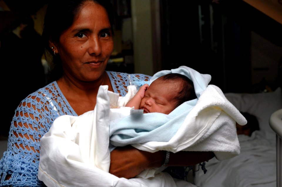 US Navy 070628-N-7088A-123 Amelia Choub, from Livingston, Guatemala, holds her granddaughter who was a patient aboard the U.S. Military Sealift Command hospital ship USNS Comfort (T-AH 20)