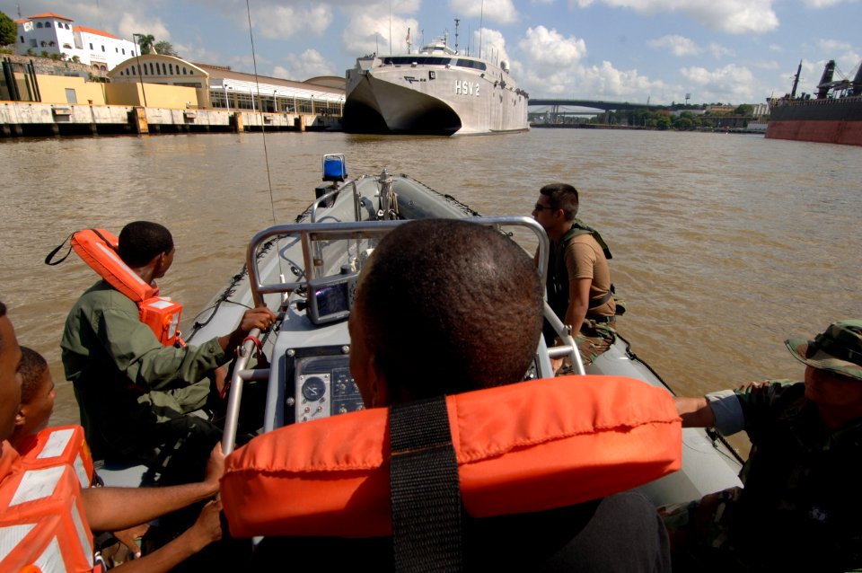 US Navy 070629-N-0989H-031 Members from the Dominican Republic army practice approach drills during coxswain subject matter exchanges photo