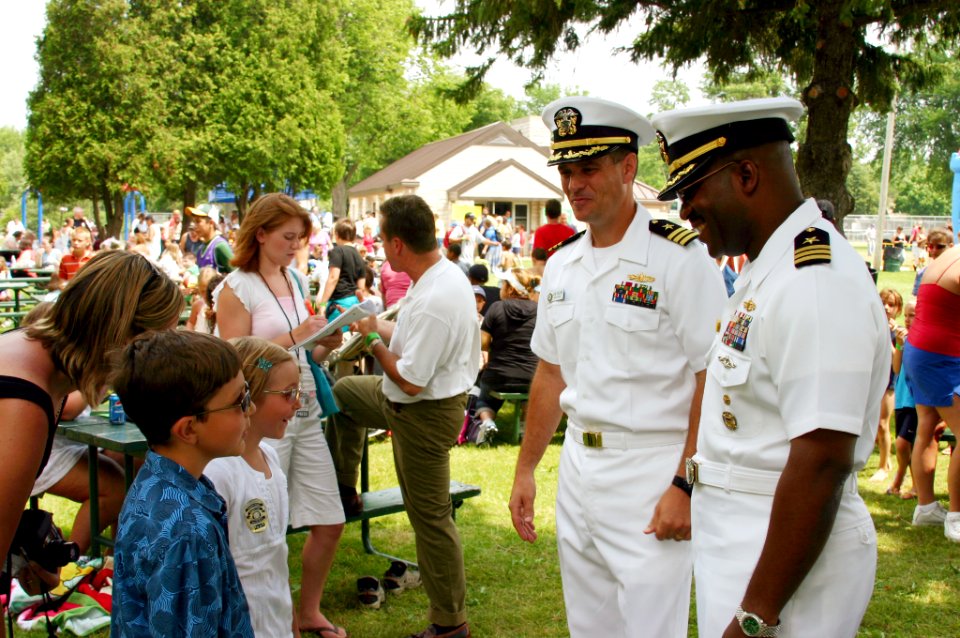 US Navy 070625-N-7163S-001 Prospective commanding officer of Precommissioning Unit (PCU) Green Bay (LPD 20) Cmdr. Cal Slocumb, right, and Cmdr. Joe Olson visit the ship's namesake city during Green Bay's Kids Day