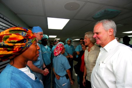 US Navy 070625-N-6081J-002 Hospital Corpsman 2nd Class Sanya M. Washington, speaks to U.S. ambassador to Belize, the Honorable Dr. Robert J. Dieter, in the main operating room of the Military Sealift Command hospital ship USNS