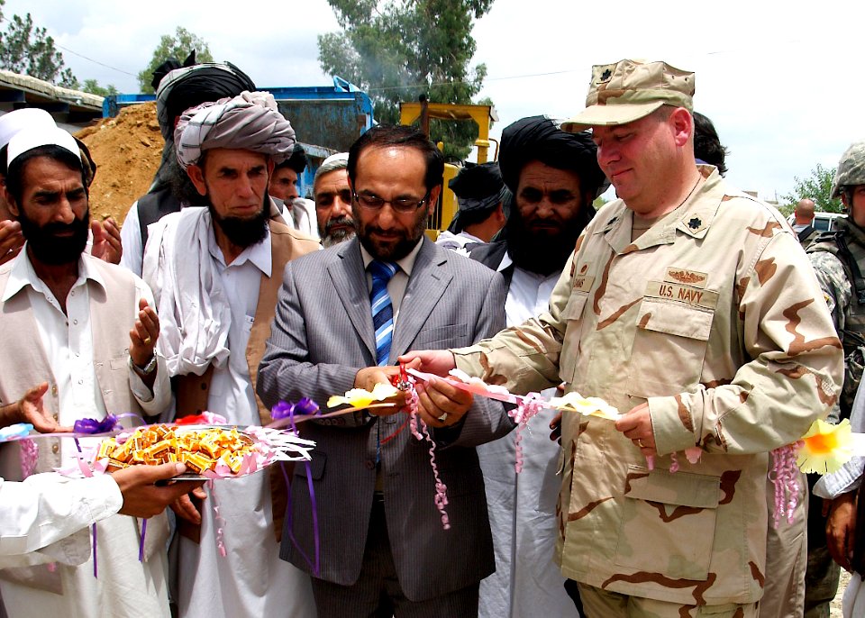 US Navy 070627-N-3385W-001 Commanding Officer of Provincial Reconstruction Team (PRT) Khost, Cmdr. David Adams and the Governor of Khost Province Arsala Jamal break ground for the Matun-Gulzar Road