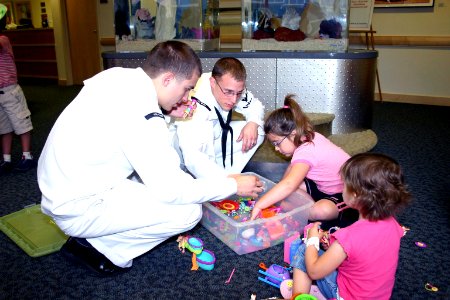 US Navy 070629-N-8110K-005 Sailors assigned to amphibious assault ship USS Wasp (LHD 1) spend time with young patients during a Caps for Kids visit to the Jimmy Fund Clinic at the Dana-Farber Cancer Institute in Boston