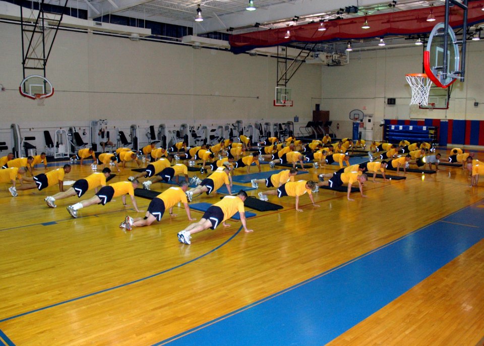 US Navy 070627-N-8053S-046 Navy senior enlisted leaders attending the Master Chief Petty Officer of the Navy's (MCPON) Leadership Mess Meeting, participate in a set of push-ups during a morning workout photo