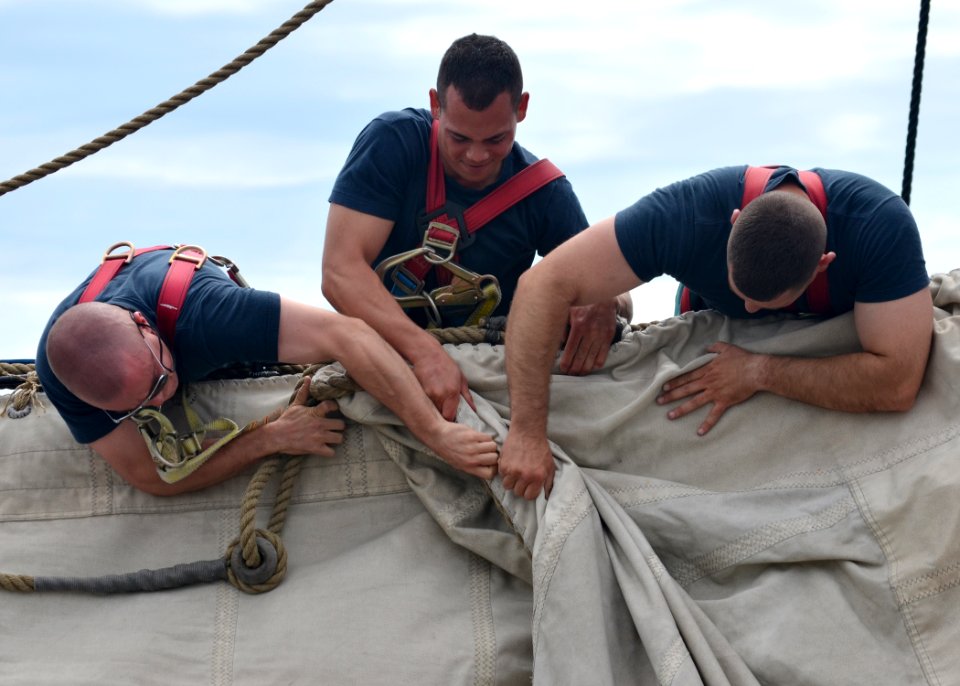 USS Constitution Sailors handle the topsail. (7365106286)
