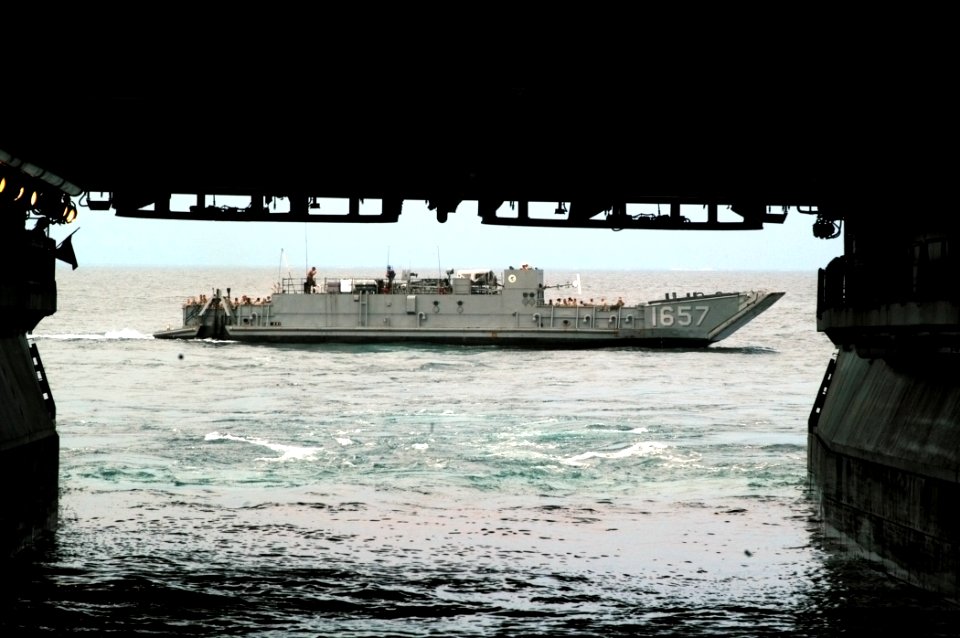 US Navy 070625-N-4014G-275 Marines of the of the 22nd Marine Expeditionary Unit (MEU) depart the well deck of amphibious assault ship USS Kearsarge (LHD 3) aboard a landing craft utility (LCU)