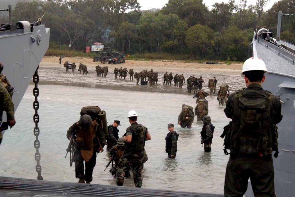 US Navy 070626-N-4124C-006 Members of the U.S. Marine Corps 3rd Marine Expeditionary Brigade, 31st Marine Expeditionary Unit (MEU) prepare to enter a Landing Craft Utility assigned to Assault Craft Unit (ACU) 1