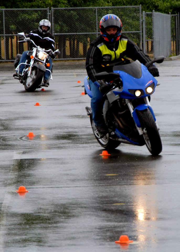US Navy 070628-N-7656R-002 Machinist's Mate 1st Class Jason Witty and Machinist's Mate 1st Class Steve Oleson, assigned to guided-missile submarine USS Ohio (SSGN 726), ride their motorcycles
