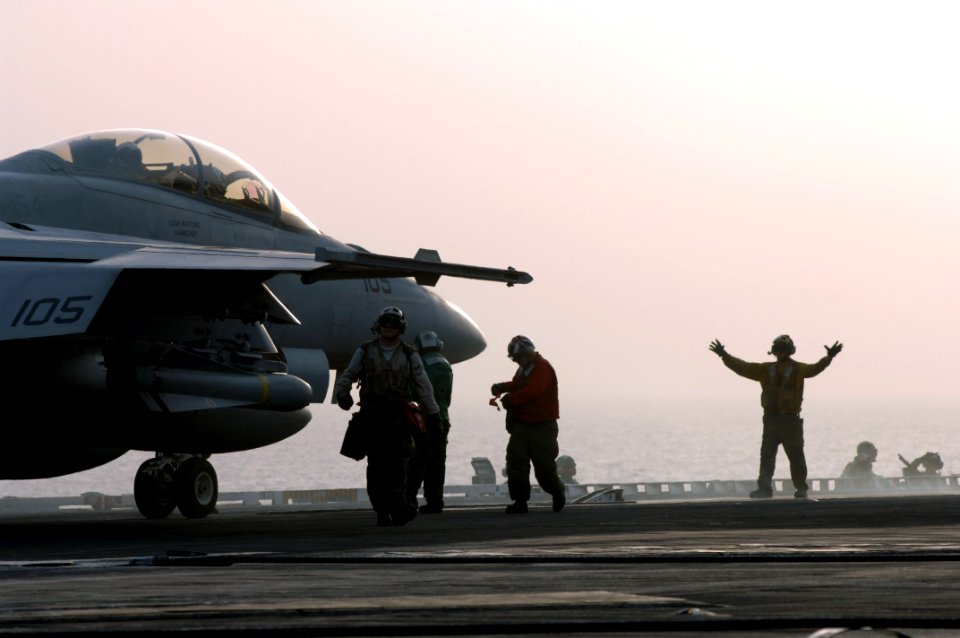 US Navy 070629-N-3729H-030 An F-A-18F Super Hornet, assigned to the Black Knights of Strike Fighter Squadron (VFA) 154, is directed to a catapult prior to launching