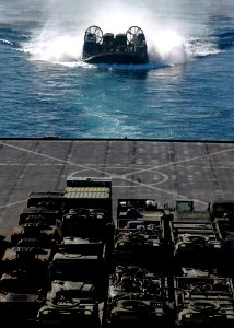 US Navy 070702-N-6710M-015 A landing craft air cushion (LCAC) prepares to enter the well deck of dock landing ship USS Tortuga (LSD 46) while carrying supplies and cargo from the 31st Marine Expeditionary Unit photo