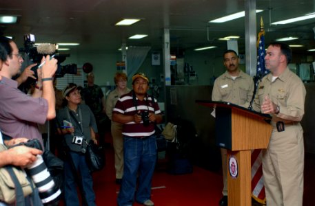 US Navy 070628-N-7088A-107 Mission commander for Military Sealift Command hospital ship USNS Comfort (T-AH 20) Capt. Bob Kapcio addresses Guatemalan press following a tour of the ship photo