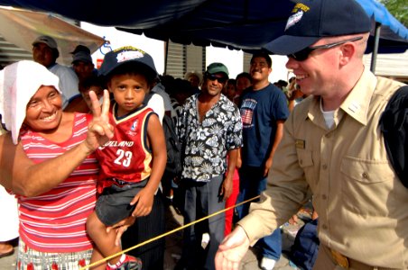 US Navy 070630-N-0194K-158 A woman and her son awaiting medical treatment at the Puerto Barrios National Medical Hospital respond with a peace sign