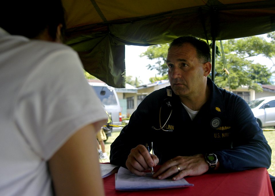 US Navy 070703-N-1752H-100 Capt. Scott Flinn, the Pacific Partnership Medical Contingent Mission Commander, performs a routine check up for a local patient during a medical-dental civic-affairs program held at Tabaco Elementary