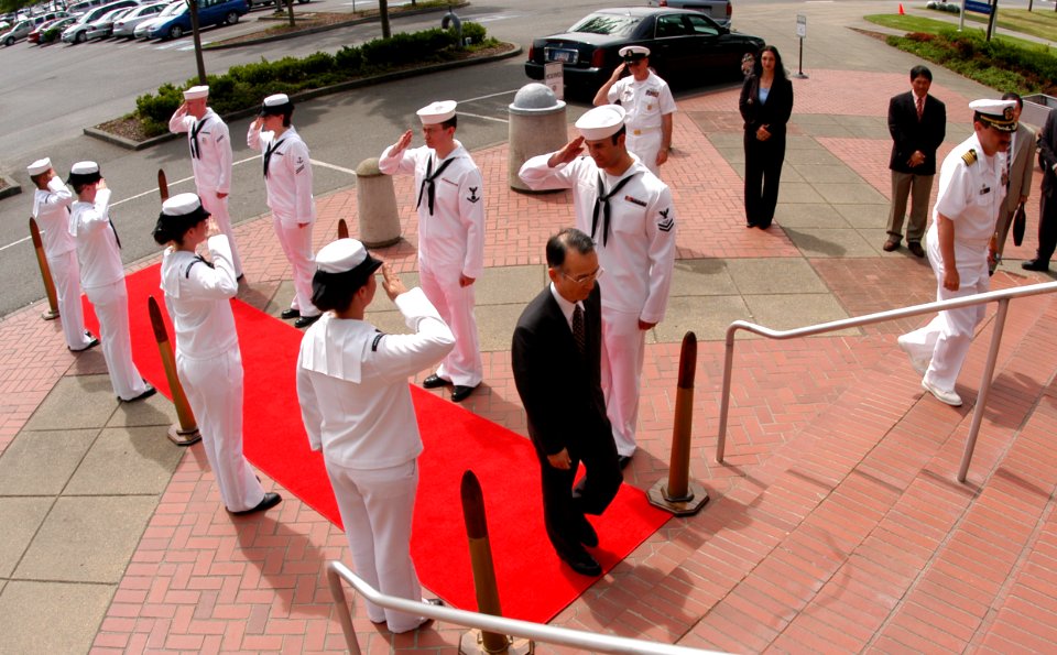 US Navy 070702-N-3390M-001 Japanese Consul Gen. Kazou Tanaka passes through side boys upon his arrival to Naval Station Everett