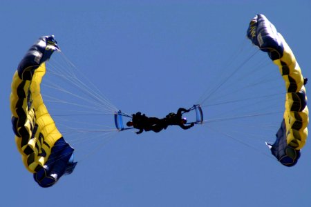US Navy 070701-N-8110K-007 Two members of the Navy Parachute Team Leap Frogs perform their trademark downplane maneuver while performing for the first time in history at Boston's Fenway Park