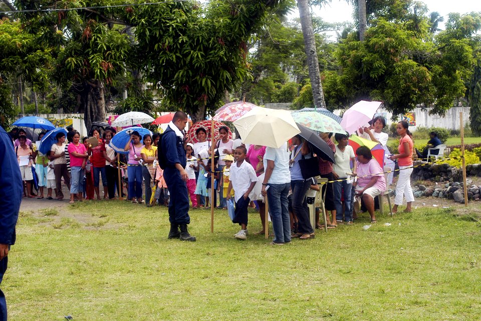 US Navy 070629-N-9195K-063 Area locals wait in line to be seen by pre-screening personnel before moving on to either dermatology, surgical screening, dental or ophthalmology during a medical-dental civic affairs program held at
