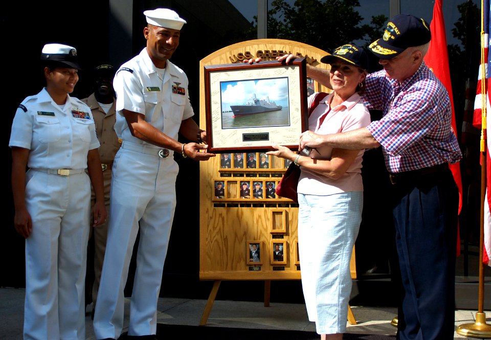 US Navy 070702-N-4163T-028 Mrs. Rose Magnus, ship's sponsor for Pre-commissioning Unit Green Bay (LPD 20), and her husband Assistant Commandant of the Marine Corps Gen. Robert Magnus receive a signed photograph of the ship duri
