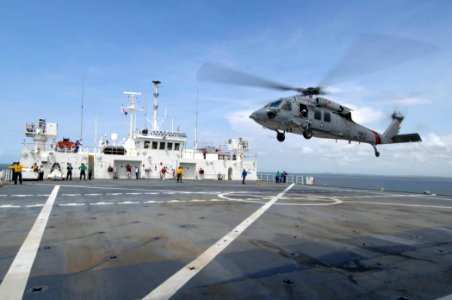 US Navy 070701-N-0194K-015 An MH-60S Seahawk, from Helicopter Sea Combat (HSC) Squadron 28, launches from the flight deck of Military Sealift Command hospital ship USNS Comfort (T-AH 20) to deliver supplies to Construction Batt