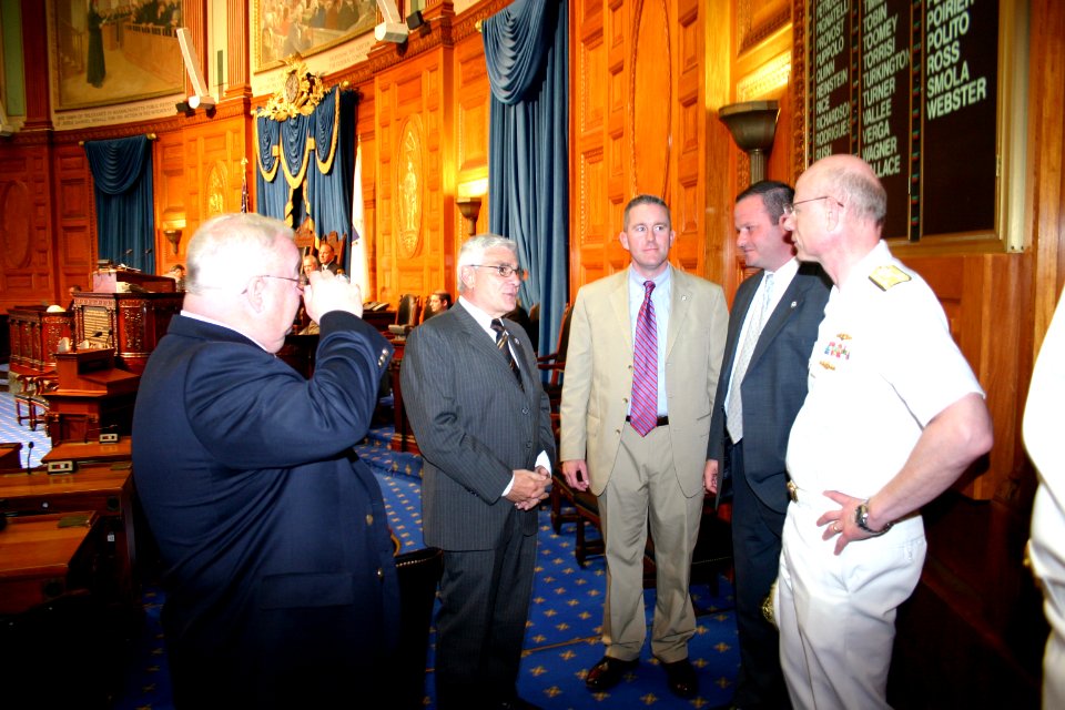 US Navy 070702-N-8110K-014 Commander, Naval Sea Systems Command, Vice Adm. Paul Sullivan speaks with members of the Commonwealth of Massachusetts House of Representatives during a recess from their legislative duties