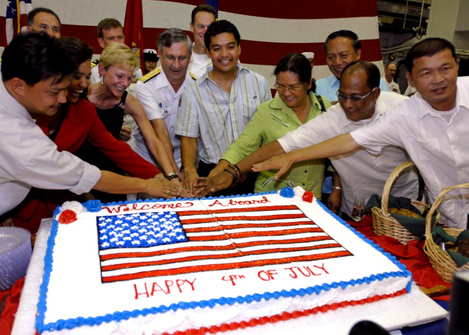 US Navy 070704-N-4954I-078 Vice Adm. Doug Crowder is joined by U.S. Ambassador to the Philippines, the Honorable Kristie A. Kenny and government officials from the Bicol region for a cake cutting during a 4th of July reception