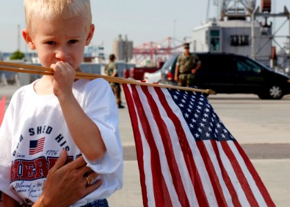 US Navy 070703-N-5330L-021 A young boy waits for his grandfather to arrive aboard guided-missile destroyer USS Nitze (DDG 94) as ships of Bataan expeditionary Strike Group (ESG) returned home after their six-month deployment