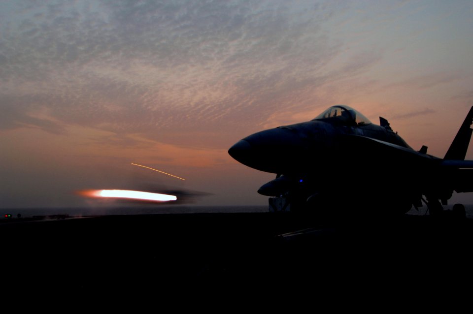 US Navy 070703-N-3729H-216 An F-A-18C Hornet, attached the Death Rattlers of Marine Strike Fighter Squadron (VMFA) 323, launches off the flight deck of Nimitz-class aircraft carrier USS John C. Stennis (CVN 74)