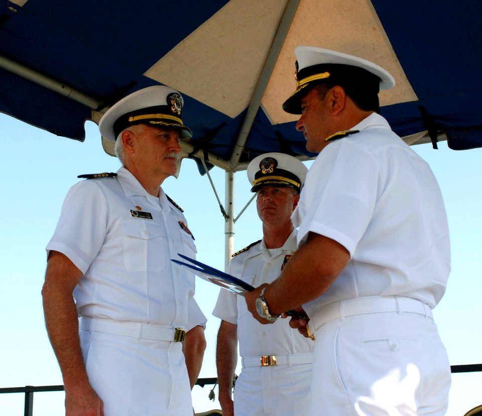 US Navy 070706-A-4074M-007 Capt. Bruce C. Meneley, center, relieves Capt. Ronald L. Sollock, left, as commander of U.S. Naval Hospital and Joint Task Force (JTF) Guantanamo Bay Joint Medical Group during a change of command cer