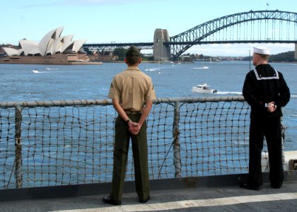 US Navy 070707-N-6710M-001 Sailors aboard dock landing ship USS Tortuga (LSD 46) and embarked Marines assigned to the 31st Marine Expeditionary Unit man the rails as the ship departs Australia