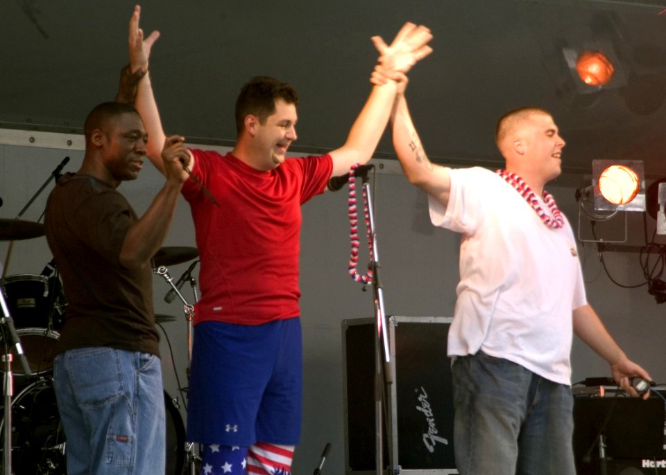 US Navy 070704-N-0483B-001 Sonar Technician (Surface) 1st Class Jonathon Edmiston celebrates after beating the Guinness World Record for the fastest escape from a straightjacket during an Independence Day celebration at Command