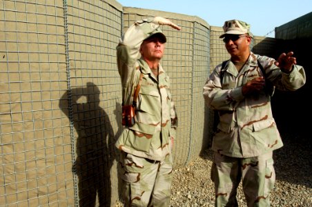 US Navy 070704-N-9818V-103 Master Chief Petty Officer of the Navy (MCPON) Joe R. Campa Jr. and Master Chief Petty Officer of the Coast Guard (MCPOCG) Charles Bowen tour Camp Liberty during their two-day visit to Iraq