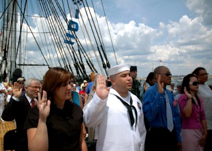 US Navy 070704-N-2893B-002 Personnelman 2nd Class Jorge Fernandez is among 10 new American citizens sworn in during a naturalization ceremony aboard USS Constitution on her Independence Day underway demonstration