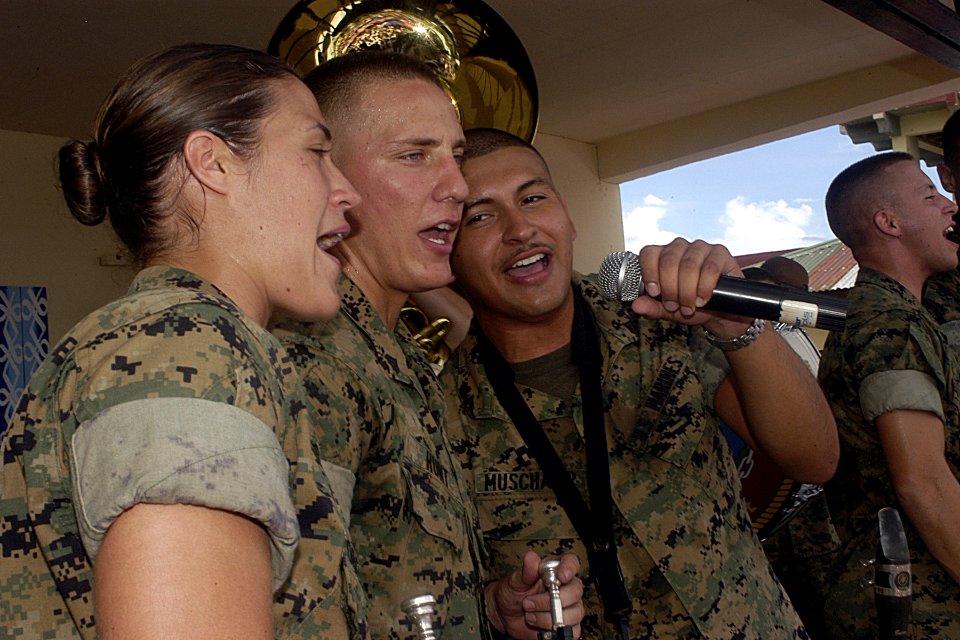 US Navy 070706-N-9195K-055 Cpl. Julia Roberts, Cpl. Michael Hunt and Cpl. Lancelot Muschamp harmonize during a goodwill performance at Tabaco City High School in support of Pacific Partnership 2007
