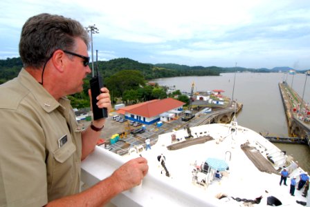 US Navy 070710-N-8704K-039 Capt. Ed Nanartowich, civilian shipmaster for Military Sealift Command hospital ship USNS Comfort (T-AH 20), communicates with his crew while transiting the Panama Canal