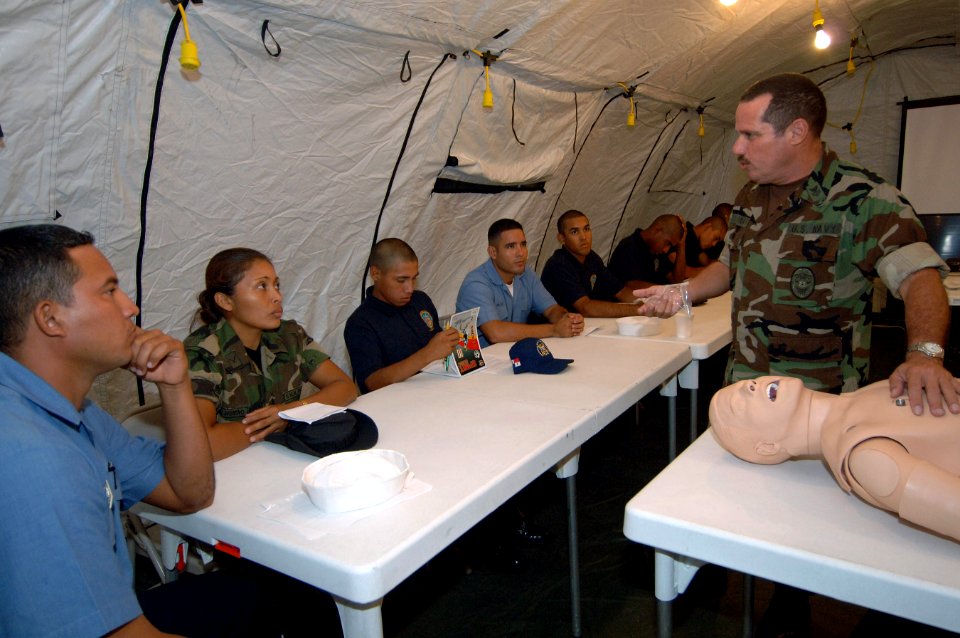 US Navy 070711-N-0989H-016 Master-at-Arms 1st Class Hector Cardona, Task Group 40.9 interpreter, demonstrates the proper procedures for providing CPR during Combat Medical Lifesaver training to Panamanian sailors