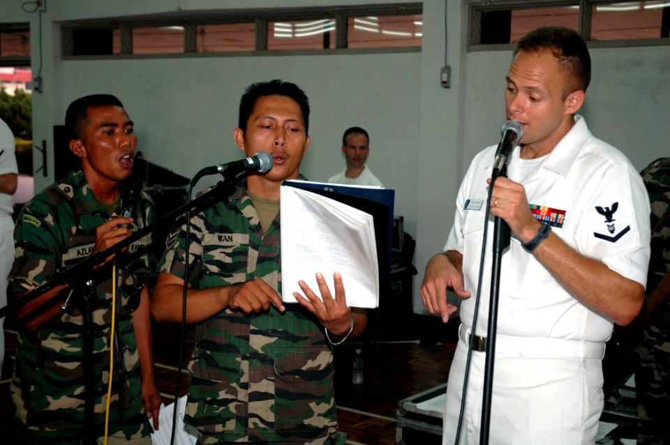 US Navy 070711-N-7783B-005 Musician 3rd Class Spence Haasenritter, the lead singer for the 7th Fleet rock band