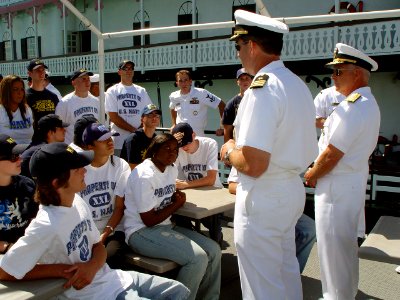US Navy 070711-N-2888Q-007 Commander, Naval Surface Forces, Vice Adm. Terrance Etnyre (center) and Commanding Officer, Navy Recruiting District Michigan, Cmdr. Greg Maguire talk to a group of Delayed Entry Program members