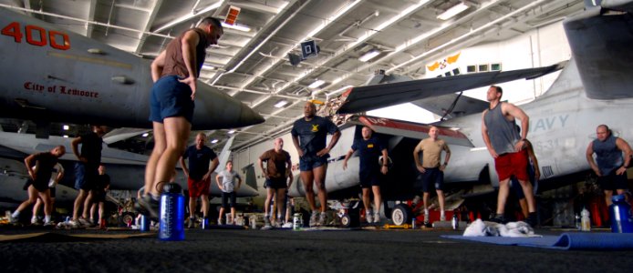 US Navy 070711-N-3541A-085 Sailors and Marines exercise during an Explosive Ordnance Disposal (EOD) Unit led workout in the hangar bay aboard Nimitz-class aircraft carrier USS John C. Stennis (CVN 74)