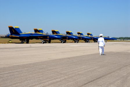 US Navy 070707-N-9909C-005 Lt. Brandon Worl walks the flight line in front of the Blue Angels at the start of the performance by the U.S. Navy Ceremonial Guard
