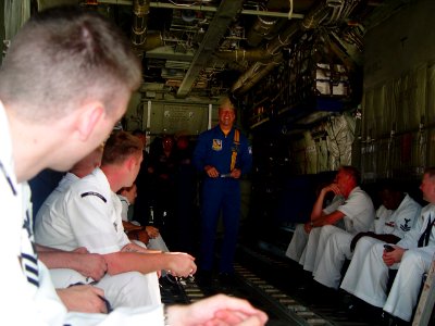 US Navy 070706-N-2888Q-001 Maj. Matt McGath briefs several Michigan recruiters before their flight on Fat Albert, the U.S. Marine Corps C-130 Hercules assigned to the Blue Angels