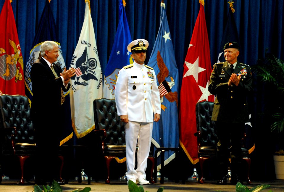 US Navy 070709-D-7203T-012 Secretary of Defense Robert M. Gates and U.S. Army Gen. Doug Brown applaud for Adm. Eric T. Olson, commander of U.S. Special Operations Command (USSOCOM) during a change of command ceremony at the Tam