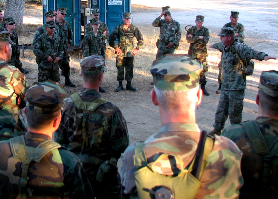 US Navy 070712-N-8547M-015 Gunnery Sgt. Ronald E. Russell, Marine Corps advisor to Naval Mobile Construction Battalion (NMCB) 5, briefs Sailors before a land navigation evolution during a field exercise (FEX)