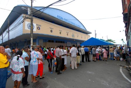 US Navy 070706-N-8704K-014 Patients line up outside the Paul Brown Arena, to receive medical care from personnel assigned to Military Sealift Command hospital ship USNS Comfort (T-AH 20) photo