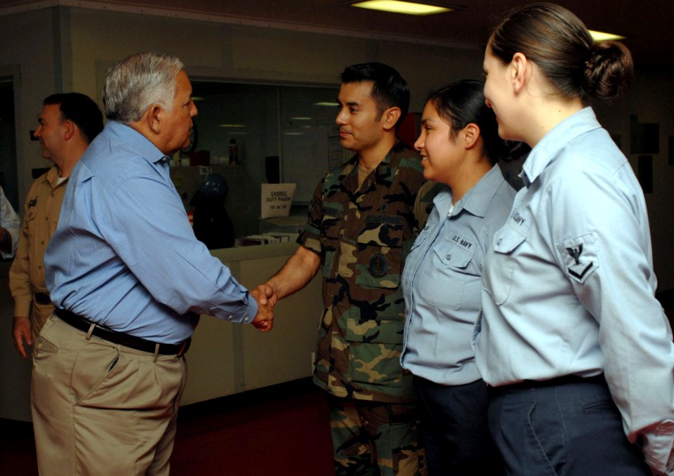 US Navy 070707-N-7088A-007 Rep. Silvestre Reyes greets Texas natives assigned to Military Sealift Command hospital ship USNS Comfort (T-AH 20) during a tour