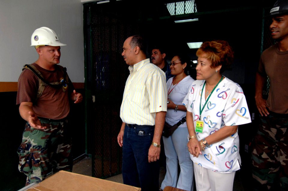 US Navy 070707-N-6278K-014 Ensign Leonard Neal, Construction Battalion Maintenance Unit (CBMU) 202 officer in charge, thanks Dr. Edgar Coto, regional director of Centro De Salud Patricia Duncan, and his staff for welcoming his