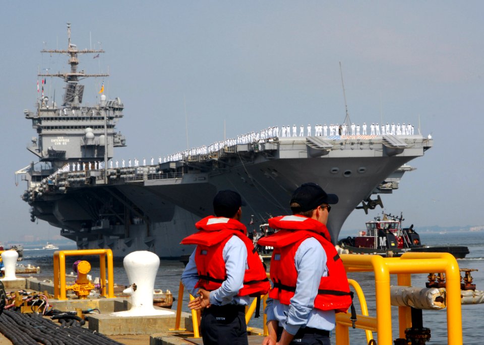 US Navy 070707-N-1713L-045 Line handlers stand by as USS Enterprise (CVN 65) gets underway for a scheduled deployment