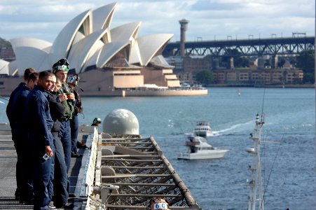 US Navy 070710-N-7883G-033 USS Kitty Hawk (CV 63) Sailors take their final look at Sydney Harbor as the ship pulls out of port