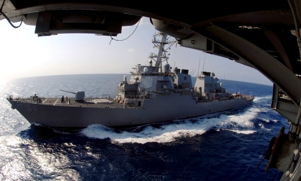 US Navy 070711-N-8923M-037 Guided-missile destroyer USS Carney (DDG 64) sails alongside Nimitz-class aircraft carrier USS Harry S. Truman (CVN 75) during a replenishment at sea