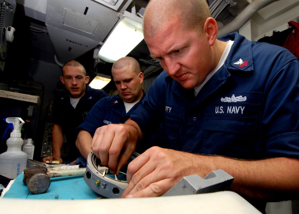 US Navy 070714-N-7981E-064 Sailors assigned to Combat Systems Department inspect repairs made on the gimbal motor of a phase array search antenna for the ship's close-in weapons system aboard Nimitz-class aircraft carrier USS A