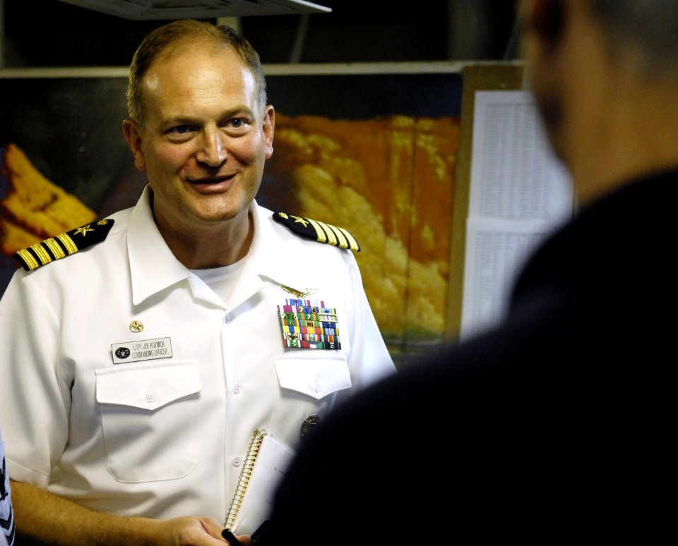 US Navy 070718-D-7203T-004 Capt. Joe Kuzmick, commanding officer of Blue Ridge-class amphibious command ship USS Mount Whitney (LCC 20), speaks with Deputy Secretary of Defense Gordon R. England during a visit to the ship off t