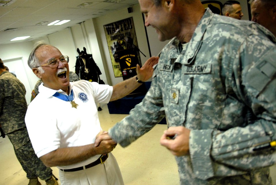 US Navy 070717-F-0193C-005 Medal of Honor recipient, retired Marine colonel, and deputy Assistant Secretary of the Navy Barney Barnum thanks a U.S. Army Soldier attached to the 1st Cavalry Division for his service at Camp Liber