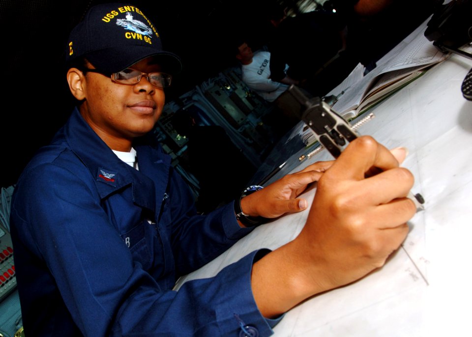 US Navy 070715-N-5928K-002 Quartermaster 2nd Class Roscille Cobb plots the ship's course on the bridge of nuclear-powered aircraft carrier USS Enterprise (CVN 65)